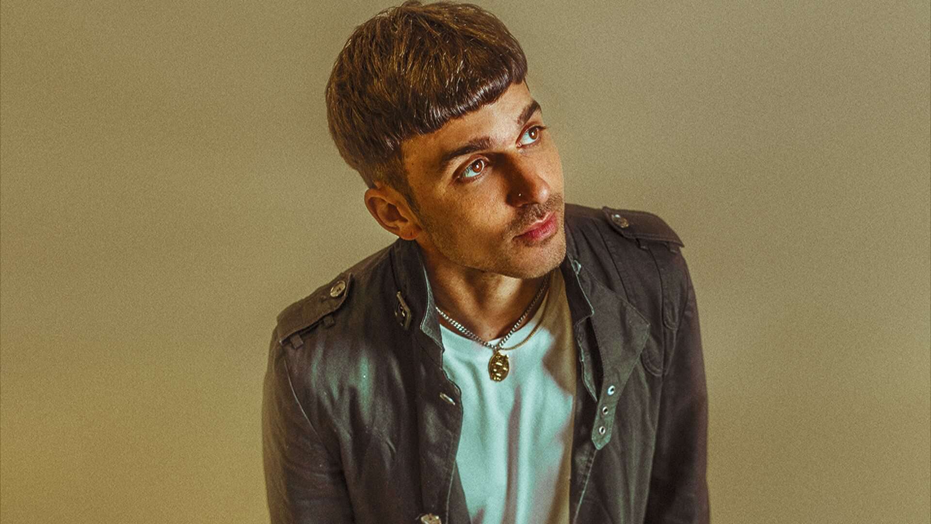 Michael Bibi in a press photo, looking off-camera